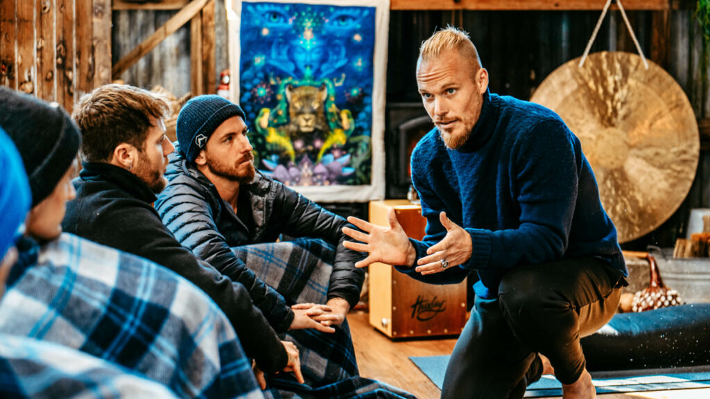 A breathwork instructor teaching a group of breathwork students.