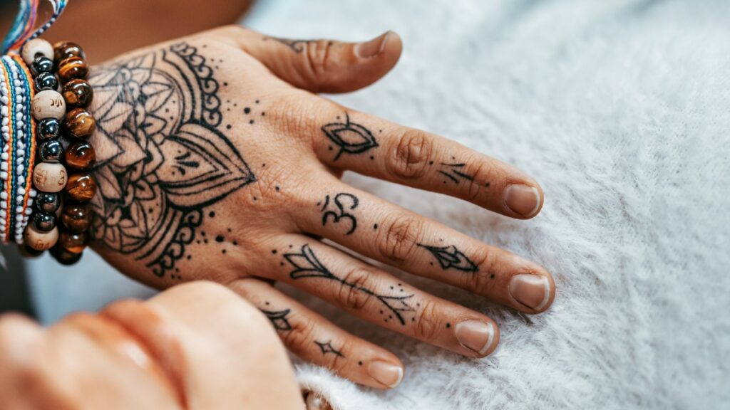 A hand resting on the chest of someone who is practising deep breathing.